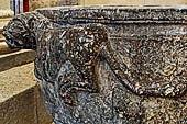 The cathedral of Cefal - Baptismal font (sec. XII) of dark marble and decorated with lions in bas-reliefs. 