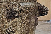 The cathedral of Cefal - Baptismal font (sec. XII) of dark marble and decorated with lions in bas-reliefs. 