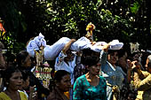 Cremation ceremony - Held over everyone's heads, the corpse is led by the kajang and placed inside the coffin. 