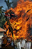 Cremation ceremony - The fuel ignites under the pyre and the splendid tower - coffin, offerings, decorations - is engulfed in flames.