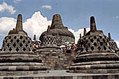 Borobudur - The 72 small stupa containing the Buddha statues on the upper three circular terraces around the central stupa. 