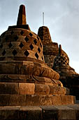 Borobudur - The 72 small stupa containing the Buddha statues on the upper three circular terraces around the central stupa. 