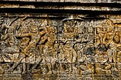 Borobudur reliefs - First Gallery, Western side - Panel 49. Lalitavistara. Sakiamuni shoots an arrow through 7 trees.