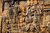 Borobudur reliefs - First Gallery, Western side - Lalitavistara. Panel 55. King tries to entertain Sakiamuni.