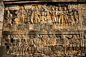 Borobudur reliefs - First Gallery, Northern side - Lalitavistara. Panel 90. Sakiamuni asks for a bunch of grass (Sakiamuni and Svastika).