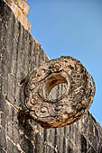 Chichen Itza - The Ball Game, the stone ring set into the central part of the wall, the ring is decorated with two entwined serpents. 