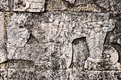 Chichen Itza - Great Ball court. Detail of the bas-reliefs on the side benches. 