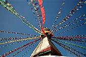 Bodhnath - The finial with the famous eyes and the pinnacle with thirteen steps. 