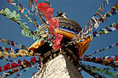 Bodhnath - The finial with the famous eyes and the pinnacle with thirteen steps. 