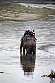 Royal Chitwan National Park - tourists oh elephant back.