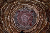 Patan  - The Golden Temple, Kalachakra mandala carved into the ceiling of the entrance.