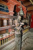 Patan  - The Golden Temple, statues of monkey which hold out jackfruits as an offering at the corners of the courtyard.