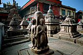 Swayambhunath Stupa - Cluster of thirty-four votive caityas of various types nearby the statue of the Buddha of light.