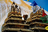 Swayambhunath - On each side of the stupa the elaborately decorated gilt copper shrines of the five Buddha.