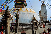 Swayambhunath - The stupa with at the sides white shikhara temples.