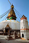 Swayambhunath - The stupa with at the sides white shikhara temples.