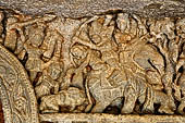 Udaigiri Ganesh Gumpha cave 10 - first tableau from right - the first scene: warriors pursue three people on an elephant.
