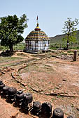 Udayagiri - Udayagiri II escavations. Small portable stupas, In the background the Hindu temple. 