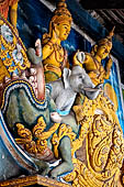 Aluvihara cave temples - Cave 1. The cave entrance. Detail of the entrance torana with Indra riding his elephant. 