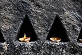 Aluvihara cave temples - Cavities in the rock boulders for oil lamps. 