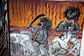Aluvihara cave temples - Cave 2. Paintings of the cave entrance. Wall paintings of the Buddhist hell. 