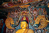 Aluvihara cave temples - Cave 1. The dragon arch overhead of the Buddha with the face of the 'Kibihiâ' and Hindu gods. 