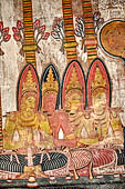 Dambulla cave temples - Cave 3, Maha Alut Viharaya (Great New Temple), paintings of the ceiling show the future Buddha, Maitreya, preaching in a Kandyan-looking pavilion to a group of splendidly adorned gods. 