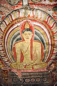 Dambulla  - Cave 2 Maharaja Vihara (Temple of the Great Kings) panels of the Defeat of Mara: Buddha is seated in bhumisparsha mudra (calling earth to witness) whilst demons attack him led by Mara  on elephant. 