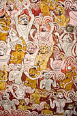 Dambulla  - Cave 2 Maharaja Vihara (Temple of the Great Kings) panels of the Defeat of Mara: Buddha is seated in bhumisparsha mudra (calling earth to witness) whilst demons attack him led by Mara  on elephant. 
