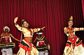 Kandyan dancing and drumming - the Puja dance with female dancers with votive oil lamps. 
