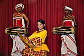 Kandyan dancing and drumming. The Kulu Dance, a traditional folk dance usually performed by village damsels.