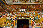 Mulkirigala cave temples - Third terrace. The entrance to the Aluth Viharaya cave. Dragon Arch decorations.