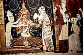 Mulkirigala cave temples - Third terrace. The Raja Mahavihara or the Old Temple. Jathaka stories paintings at the cave entrance. Detail of the scene of a Bodhisattva donating an eye.