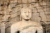 Polonnaruwa - Gal Vihara. The large seated Buddha entirely framed by a torana arch and architectural reliefs.