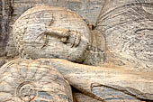 Polonnaruwa - Gal Vihara. The 14m long reclining Buddha in paranirvana mudra, on the top of the head, the ushnisha, the small protuberance denoting the Buddha superior mental powers