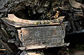 Ke'te Kesu - burial places, coffins full of bones and skulls lie rotting in piles 