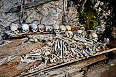 Ke'te Kesu - burial places, coffins full of bones and skulls lie rotting in piles 