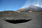 Etna - From Piccolo Rifugio to the Torre del Filosofo. The remains of the Rifugio Torre del Filosofo, the North East crater on the background.
