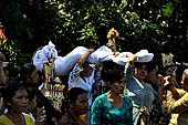 Cremation ceremony - Held over everyone's heads, the corpse is led by the kajang and placed inside the coffin.