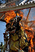 Cremation ceremony - The fuel ignites under the pyre and the splendid tower - coffin, offerings, decorations - is engulfed in flames.