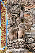 Pura Dalem of Sangsit - Details of the bas-reliefs of the temple front wall.