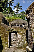 Gunung Kawi (Bali) - Alleged main monastery with rock-hewn monastic cells and a monolith in the middle of yet unknown significance. 