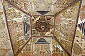 Klungkung - Bali. The Kerta Gosa palace, paintings of the upper levels. Right at the top, the lokapala, a lotus surrounded by four doves symbolizing good luck, enlightenment and salvation