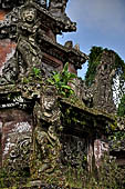 Pura Luhur Batukau - Bali - The Kulkul alarm tower with statues of directional protectors.