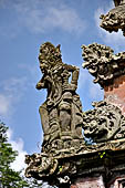 Pura Luhur Batukau - Bali - The Kulkul alarm tower with statues of directional protectors.