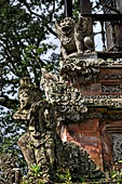 Pura Luhur Batukau - Bali - The Kulkul alarm tower with statues of directional protectors.