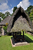 Pura Luhur Batukau - Bali - The fist courtyard. Black thatched roof pavilions. 