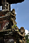 Pura Luhur Batukau - Bali - The Kulkul alarm tower detail of the statues of directional protectors.