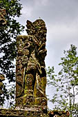 Pura Luhur Batukau - Bali - The Kulkul alarm tower detail of the statues of directional protectors.