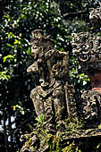 Pura Luhur Batukau - Bali - The Kulkul alarm tower detail of the statues of directional protectors. 